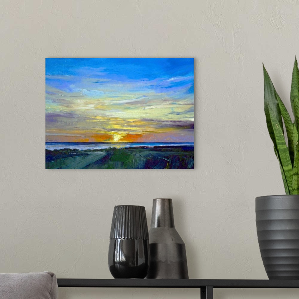A modern room featuring Oil painting of sunset over water with land in the foreground.