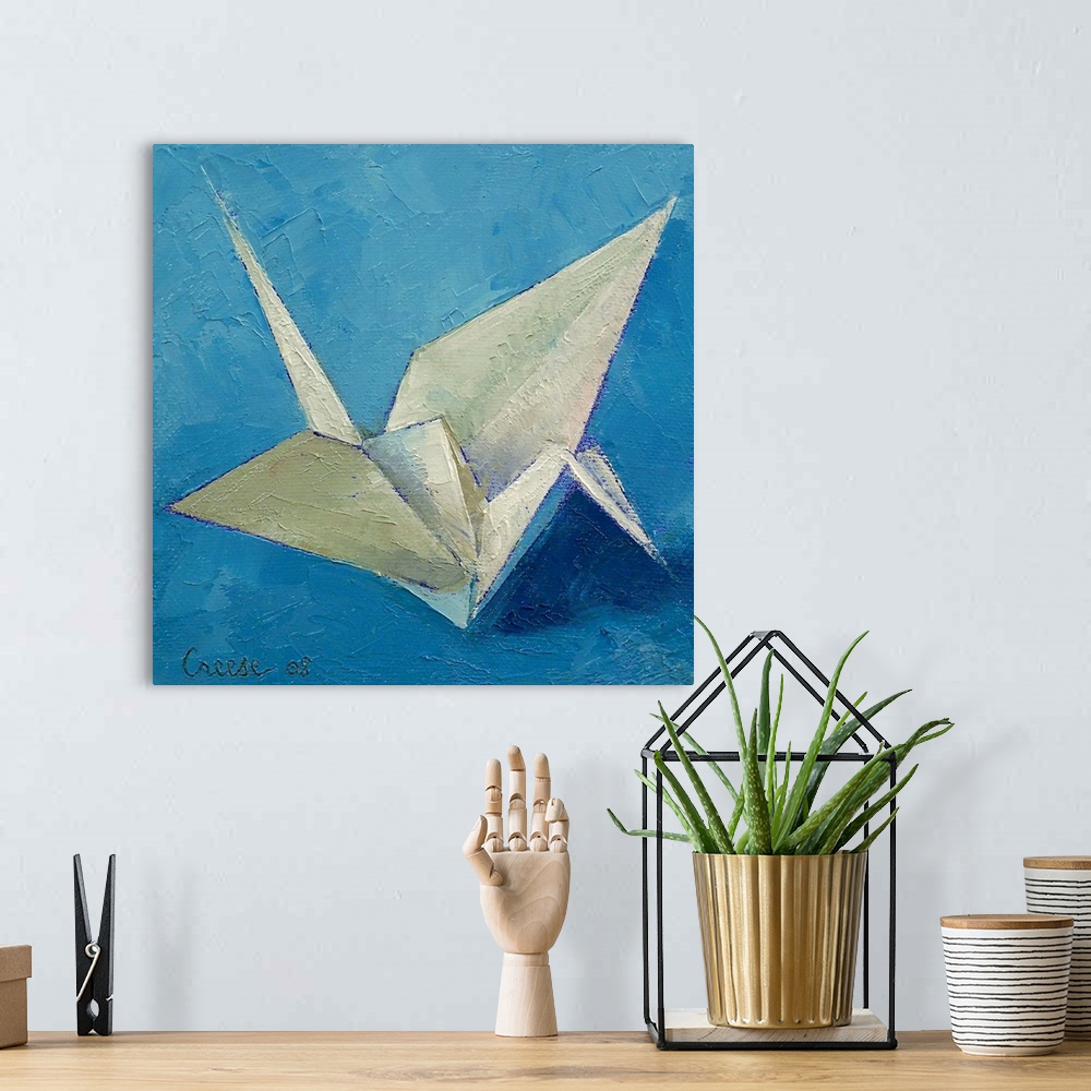 A bohemian room featuring An oil on canvas piece of a white origami crane against a shaded blue background.
