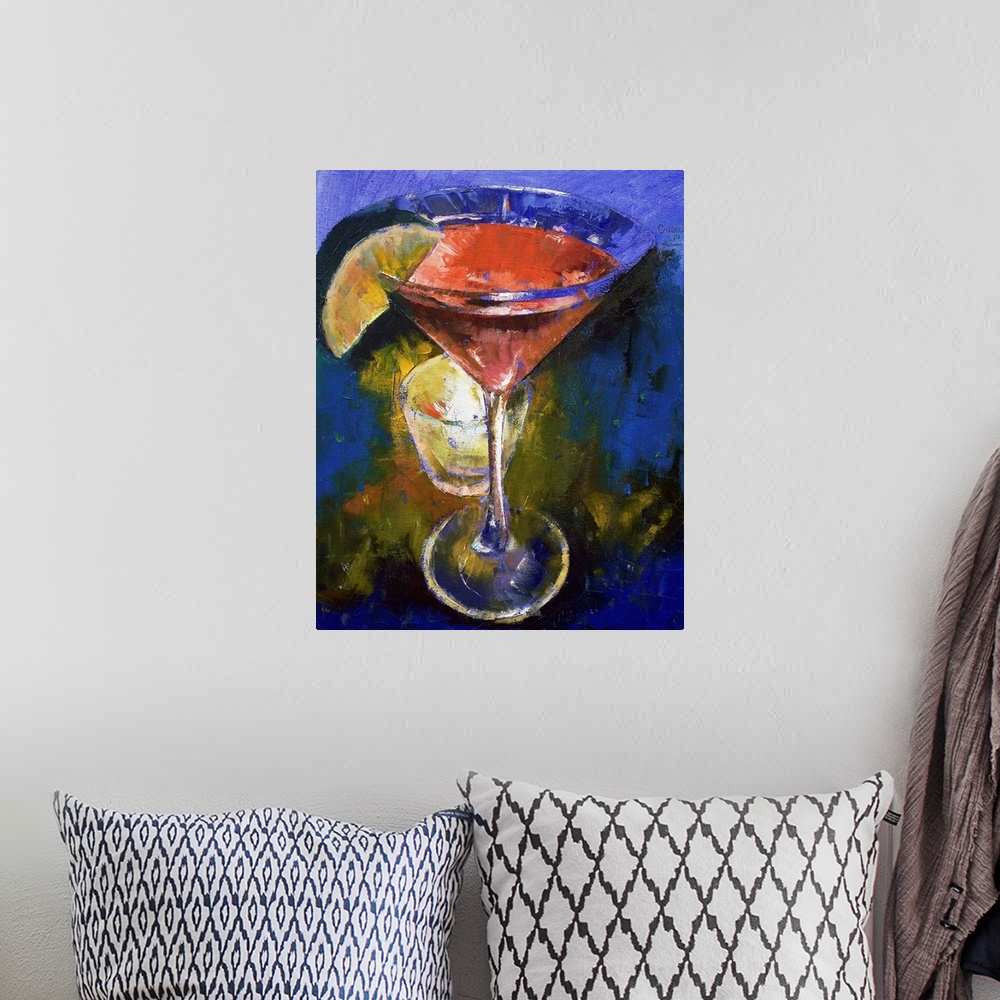 A bohemian room featuring This painting is of a martini glass that is filled with a pink liquid and a lime wedge on the sid...