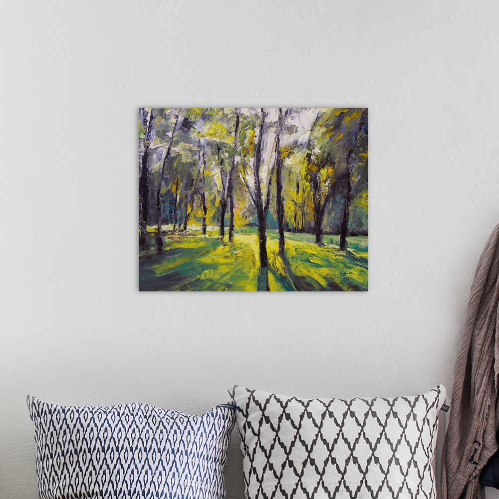 A bohemian room featuring Oil painting of brightly colored forest at dusk by an American artist.