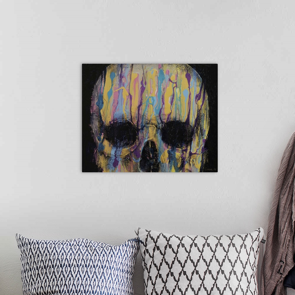 A bohemian room featuring A contemporary painting of human skull with multi-colored paint dripping from the top of its head.