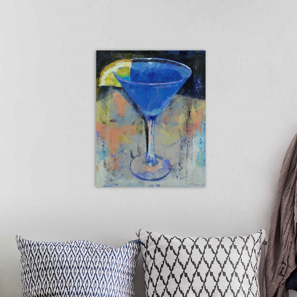 A bohemian room featuring Decorative artwork for the home of a martini glass filled with a blue drink and a lemon wedge on ...