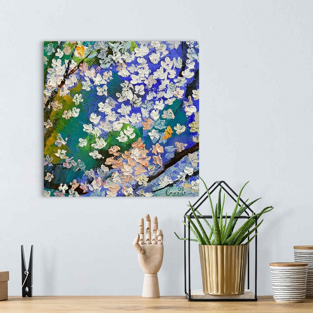A bohemian room featuring An abstracting paining of tree branches with thick dabs of paint to make the floral blossoms on t...