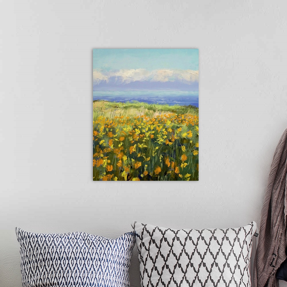 A bohemian room featuring Canvas painting of a large field of poppies stretching to the sea. Vibrant coloring of the poppie...