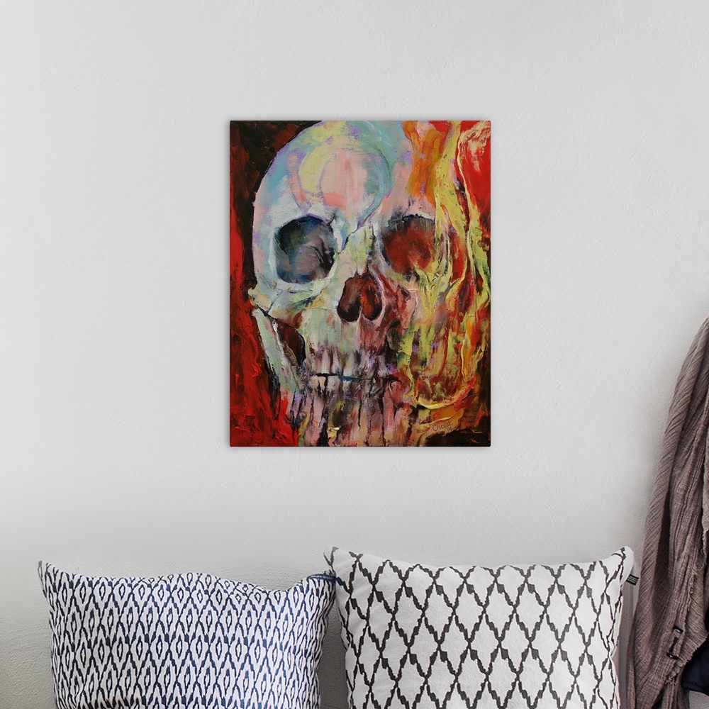 A bohemian room featuring A human skull with fire enveloping half the face.