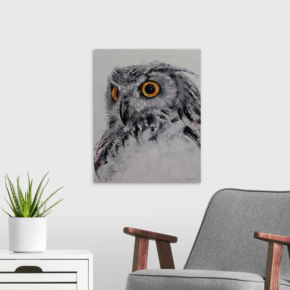 A modern room featuring A portrait of a gray owl with glaring orange eyes.