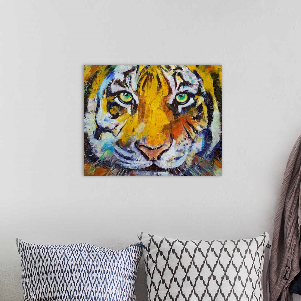 A bohemian room featuring Painting of a close up of a tigers face with his green eyes staring directly at you.