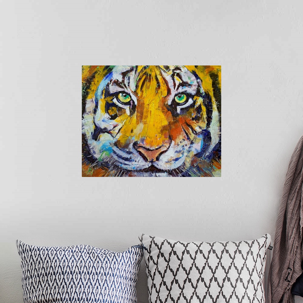 A bohemian room featuring Painting of a close up of a tigers face with his green eyes staring directly at you.