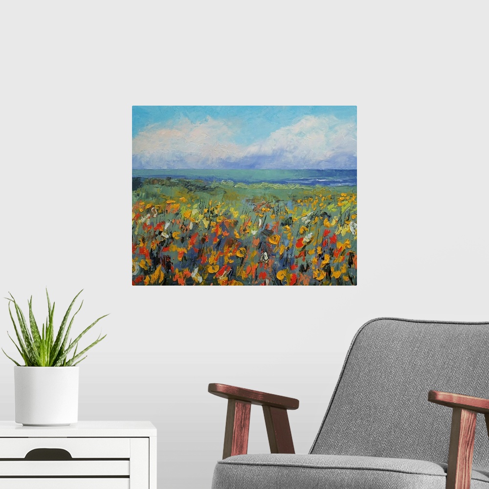 A modern room featuring Giclee print of an oil painting depicting a field of flowers, the ocean, and sky full of fluffy c...