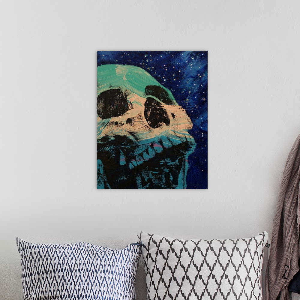 A bohemian room featuring Contemporary painting of a human skull against a background of a starry sky.