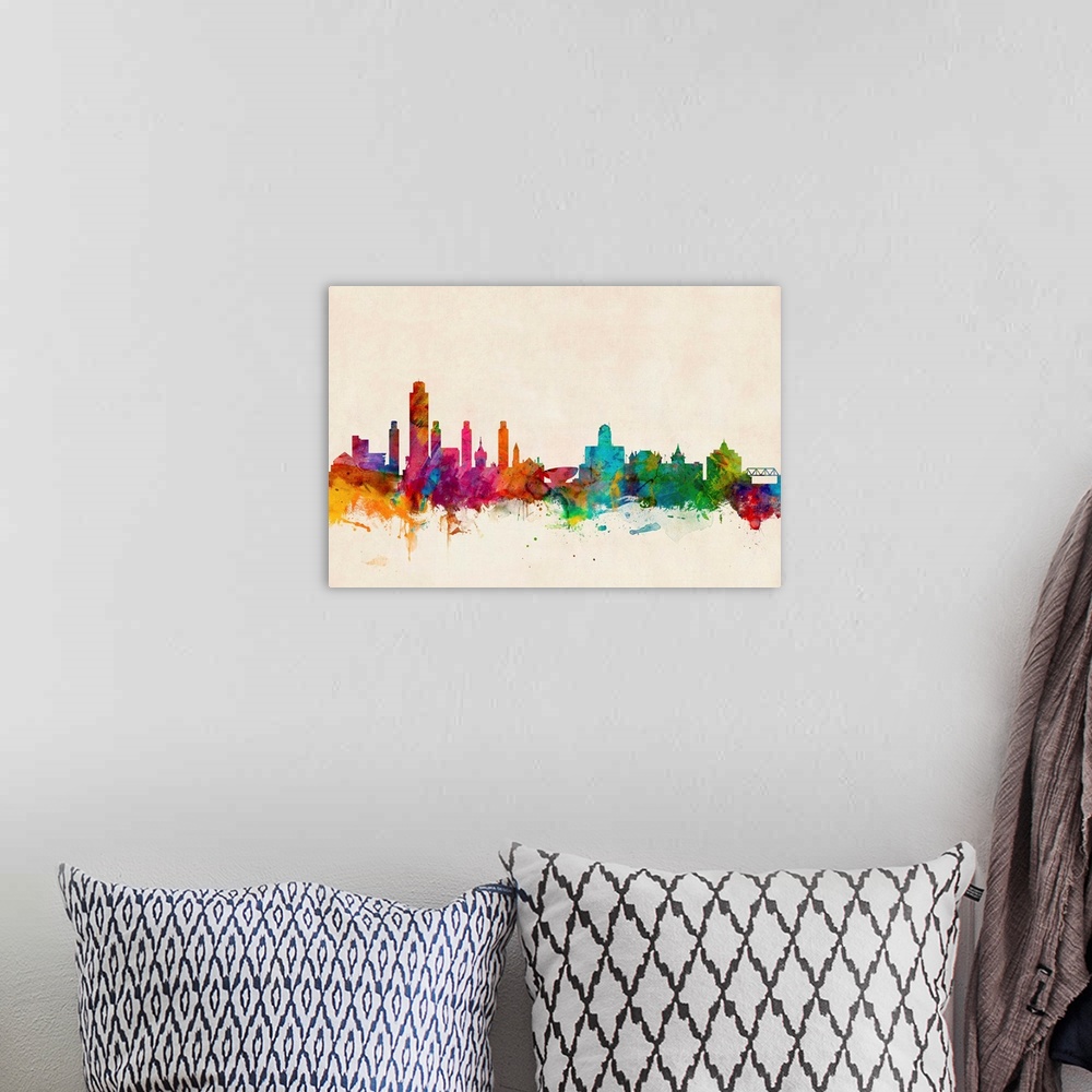 A bohemian room featuring Contemporary piece of artwork of the New York City skyline made of colorful paint splashes.