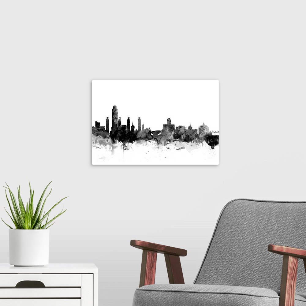 A modern room featuring Contemporary artwork of the Albany city skyline in black watercolor paint splashes.