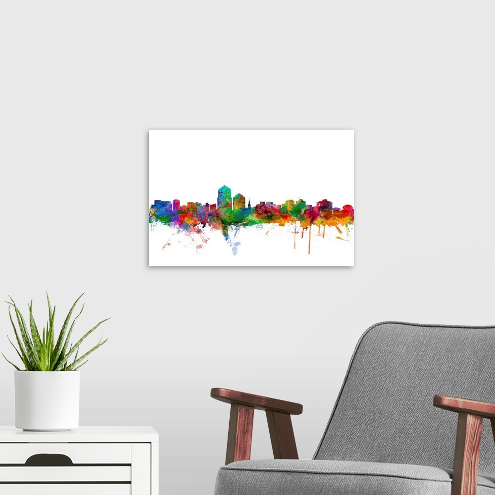 A modern room featuring Watercolor artwork of the Albuquerque skyline against a white background.