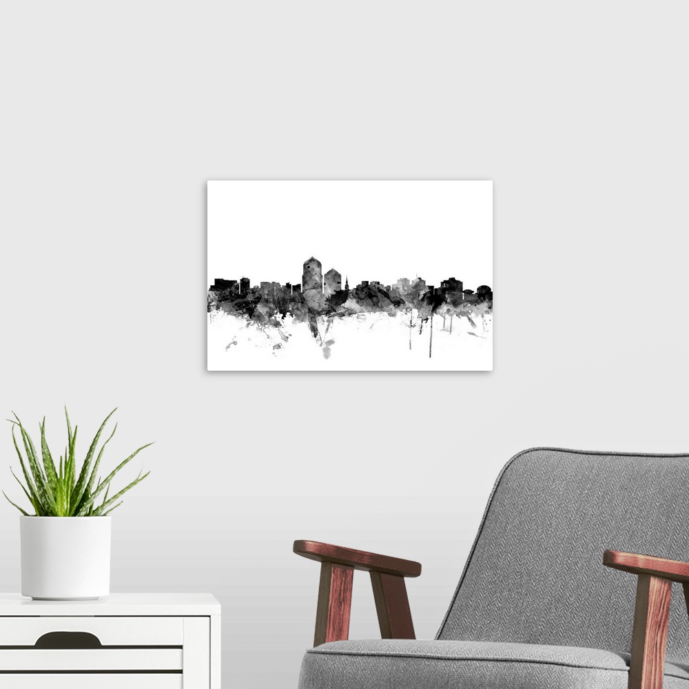 A modern room featuring Contemporary artwork of the Albuquerque city skyline in black watercolor paint splashes.