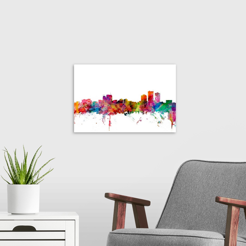 A modern room featuring Watercolor artwork of the Anchorage skyline against a white background.