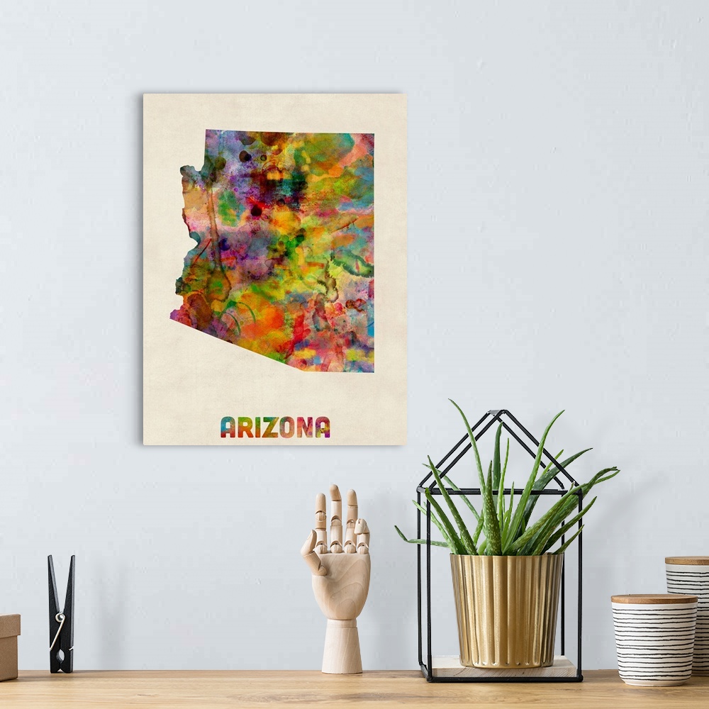 A bohemian room featuring Contemporary piece of artwork of a map of Arizona made up of watercolor splashes.