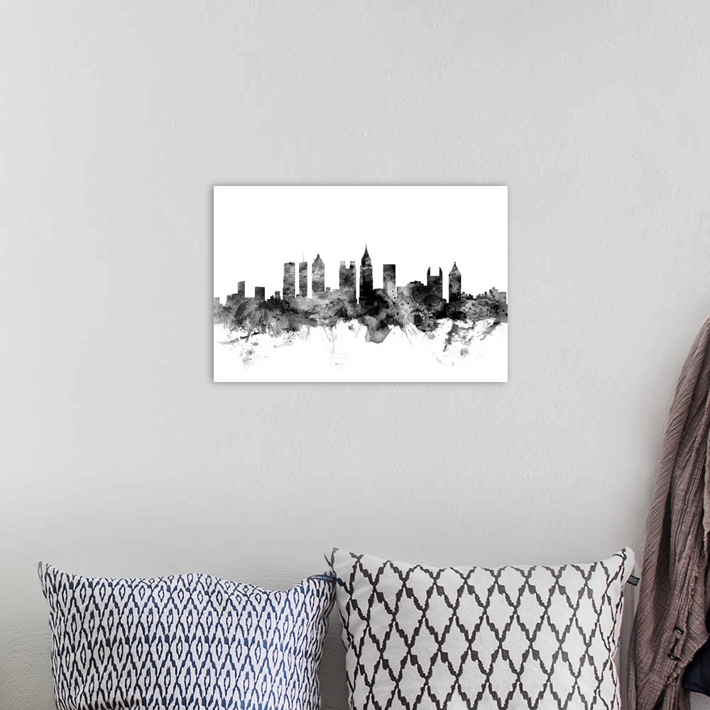 A bohemian room featuring Contemporary artwork of the Atlanta city skyline in black watercolor paint splashes.