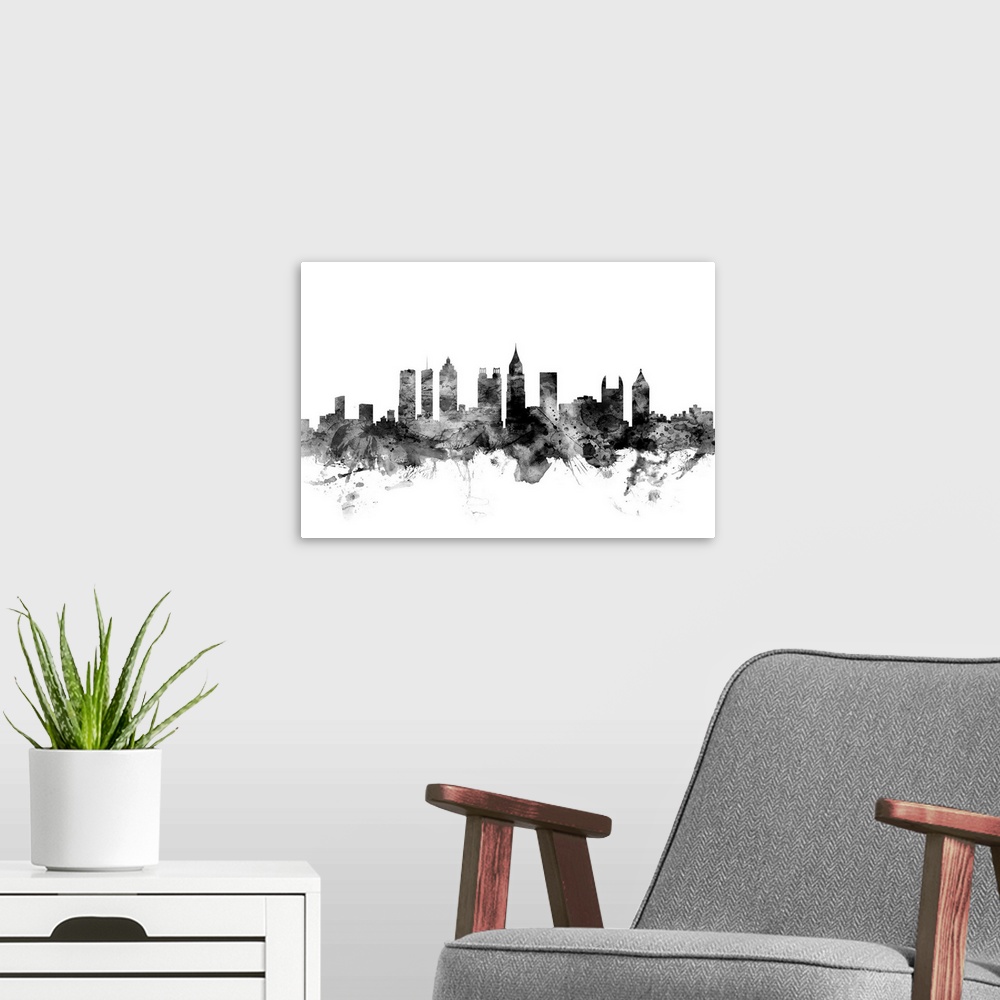 A modern room featuring Contemporary artwork of the Atlanta city skyline in black watercolor paint splashes.