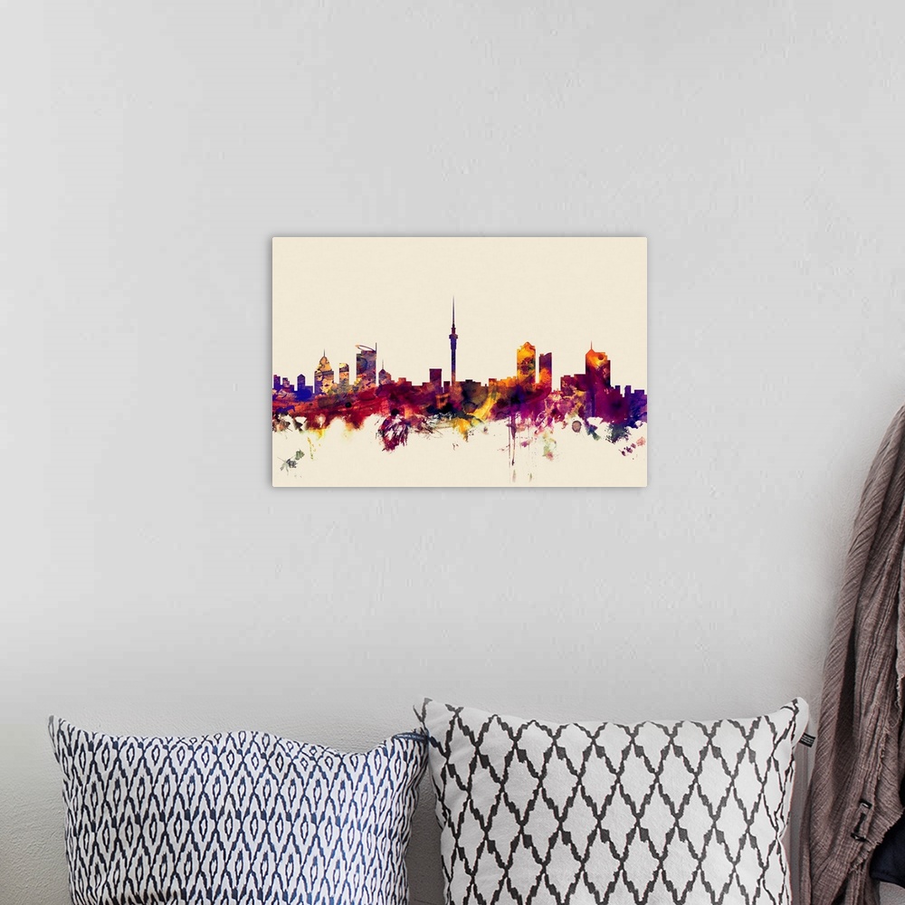 A bohemian room featuring Contemporary artwork of the Auckland city skyline in watercolor paint splashes.