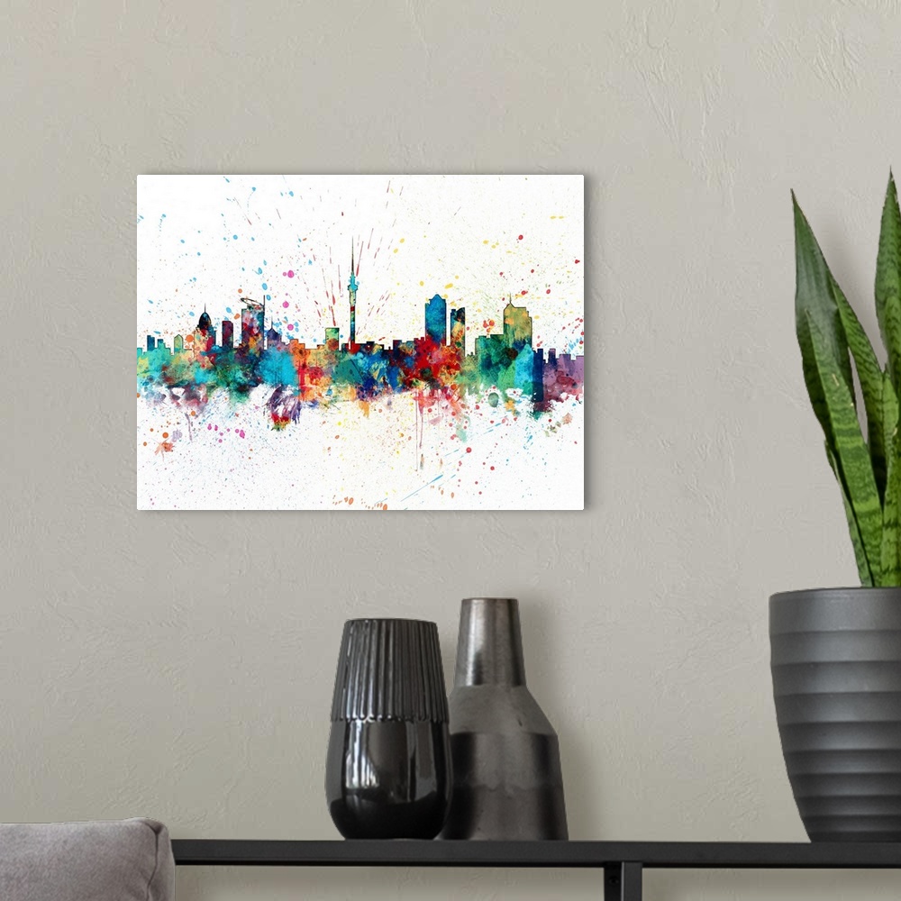 A modern room featuring paint splashes art print of the skyline of Auckland, New Zealand