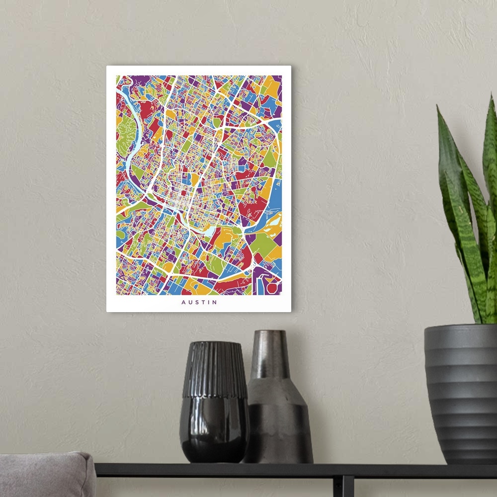 A modern room featuring A street map of Austin, Texas, United States, with land areas colored green, blue, yellow, red an...