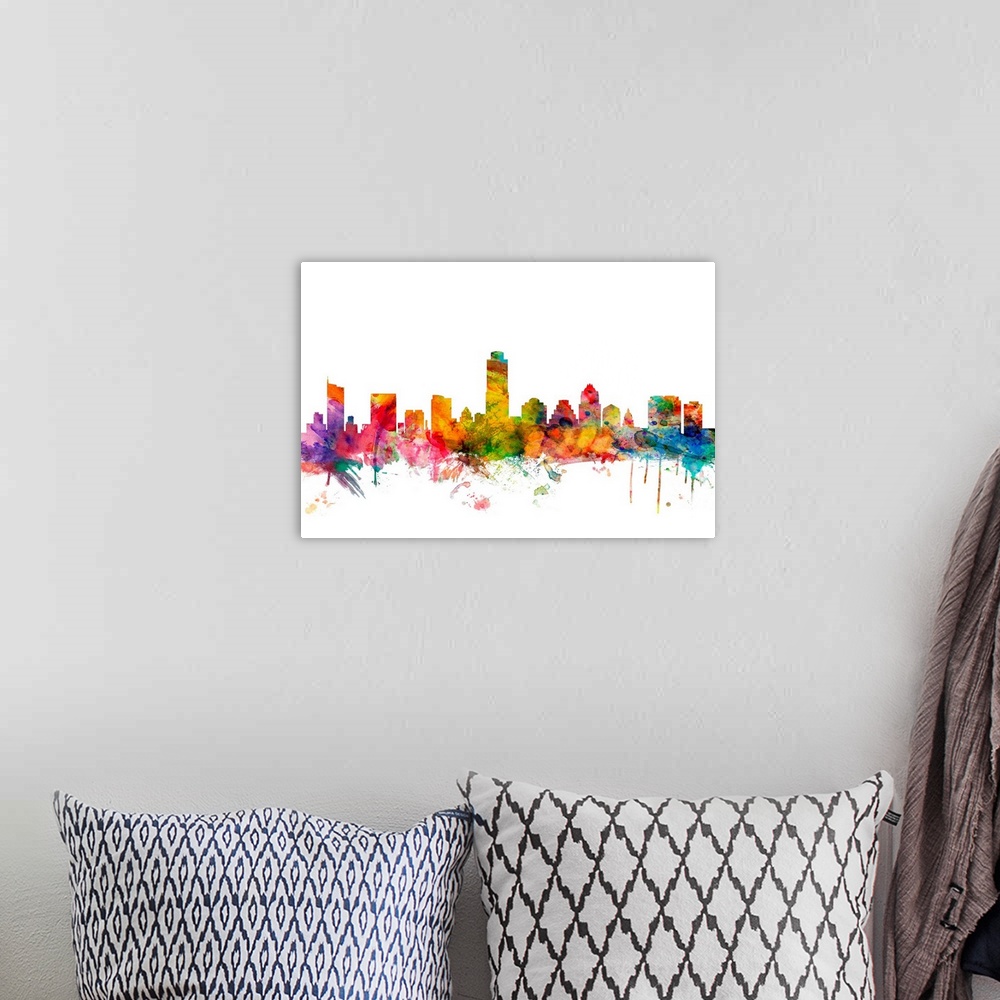 A bohemian room featuring Watercolor artwork of the Austin skyline against a white background.