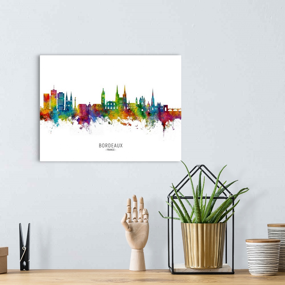 A bohemian room featuring Watercolor art print of the skyline of Bordeaux, France