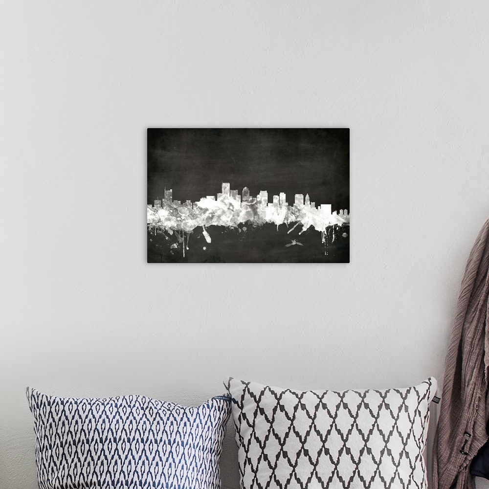 A bohemian room featuring Smokey dark watercolor silhouette of the Boston city skyline against chalkboard background.