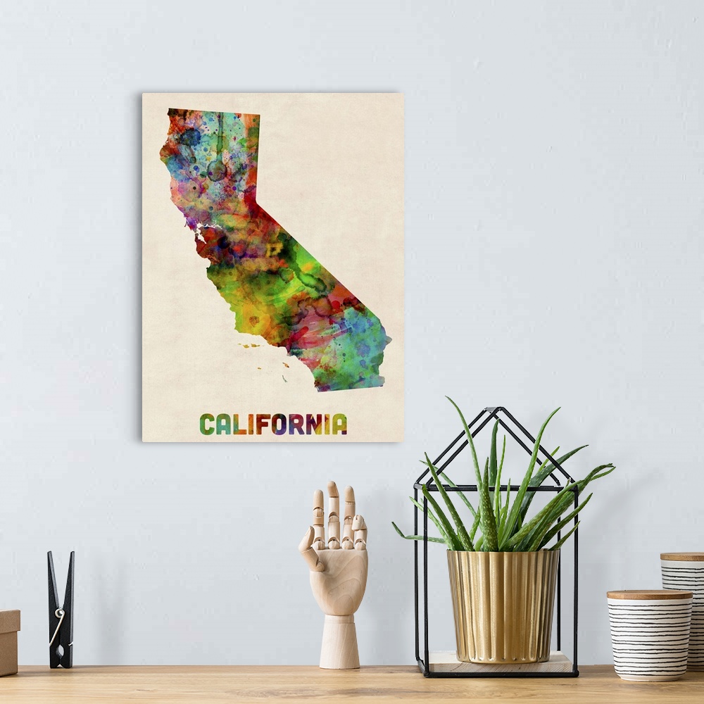 A bohemian room featuring Contemporary piece of artwork of a map of California made up of watercolor splashes.