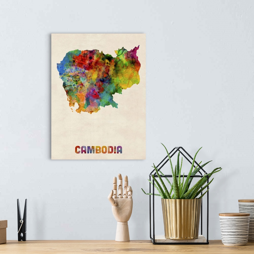 A bohemian room featuring Contemporary piece of artwork of a map of cambodia made up of watercolor splashes.