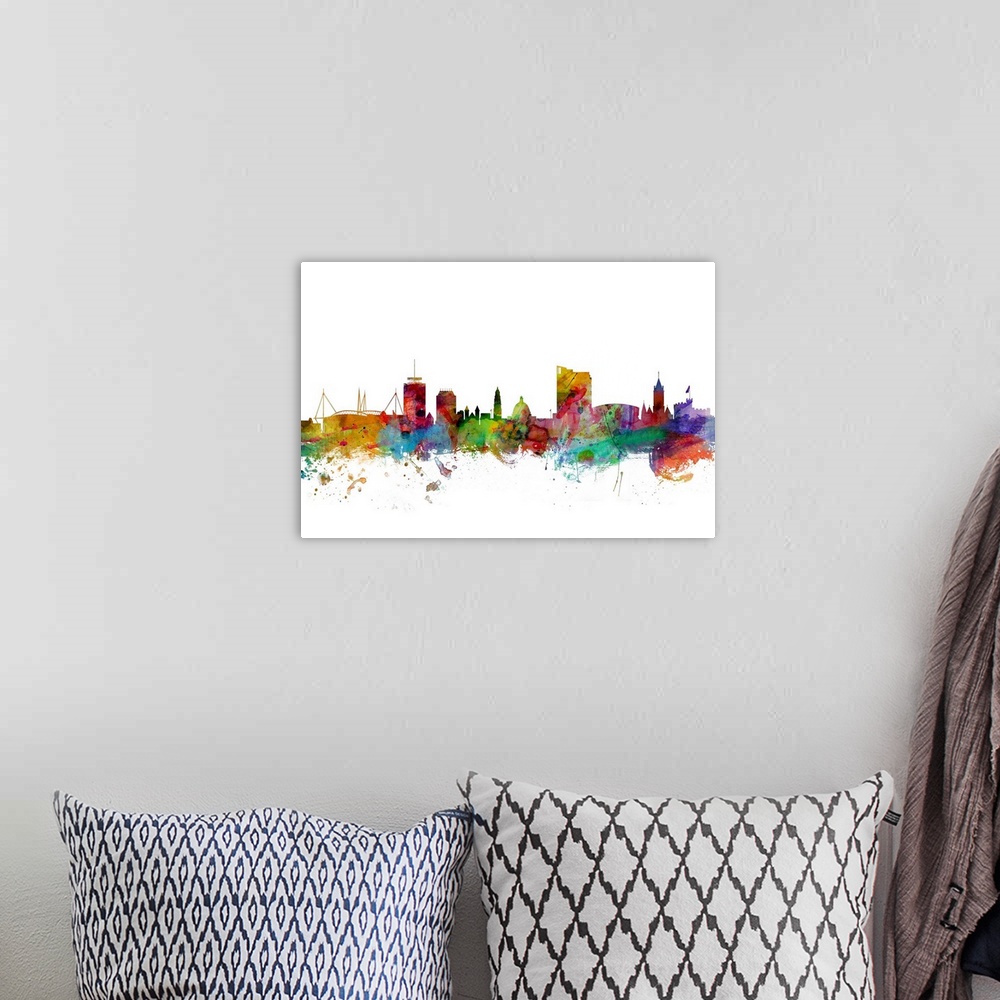 A bohemian room featuring Contemporary piece of artwork of the Cardiff, Wales skyline made of colorful paint splashes.