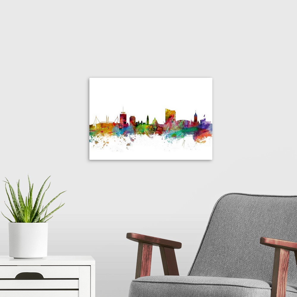 A modern room featuring Contemporary piece of artwork of the Cardiff, Wales skyline made of colorful paint splashes.