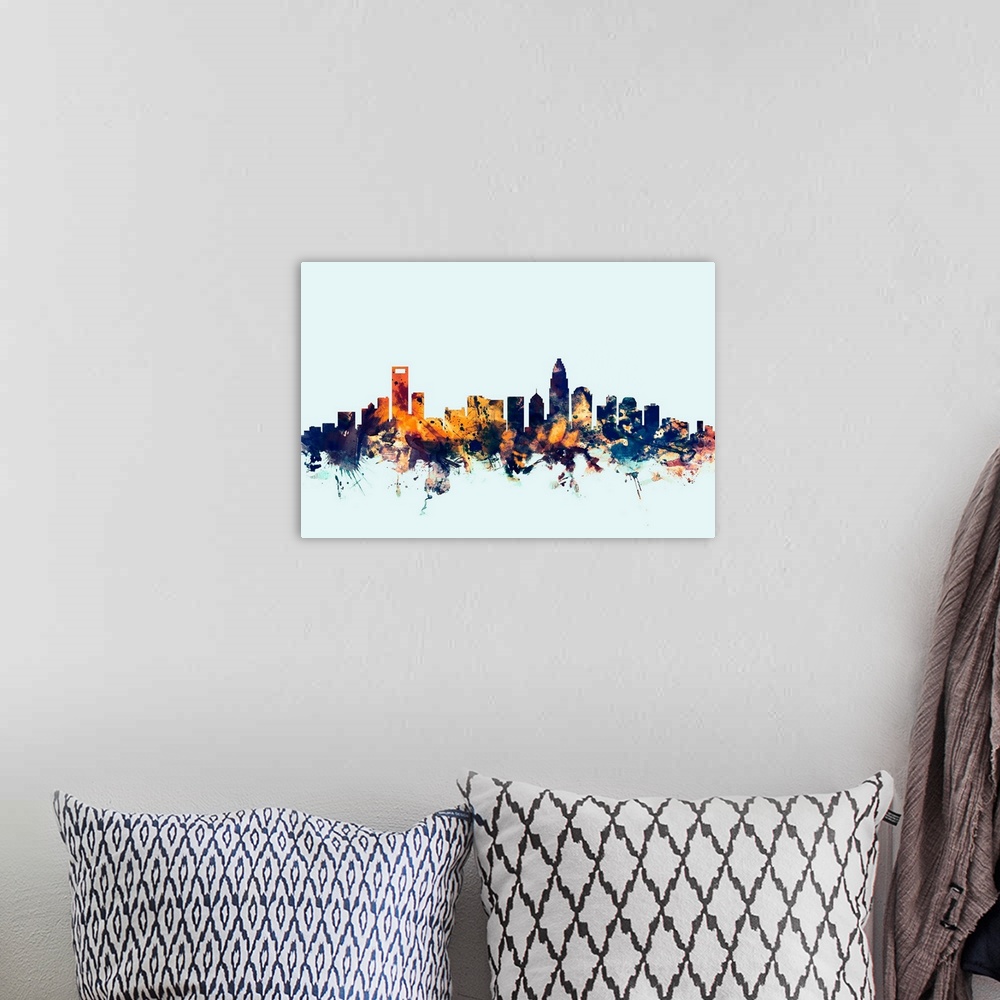A bohemian room featuring Dark watercolor silhouette of the Charlotte city skyline against a light blue background.