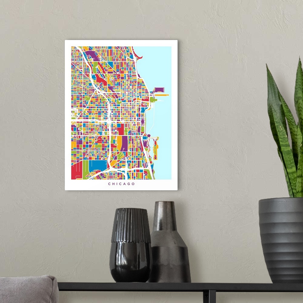 A modern room featuring A street map of Chicago, Illinois, United States, with land areas colored green, blue, yellow, re...