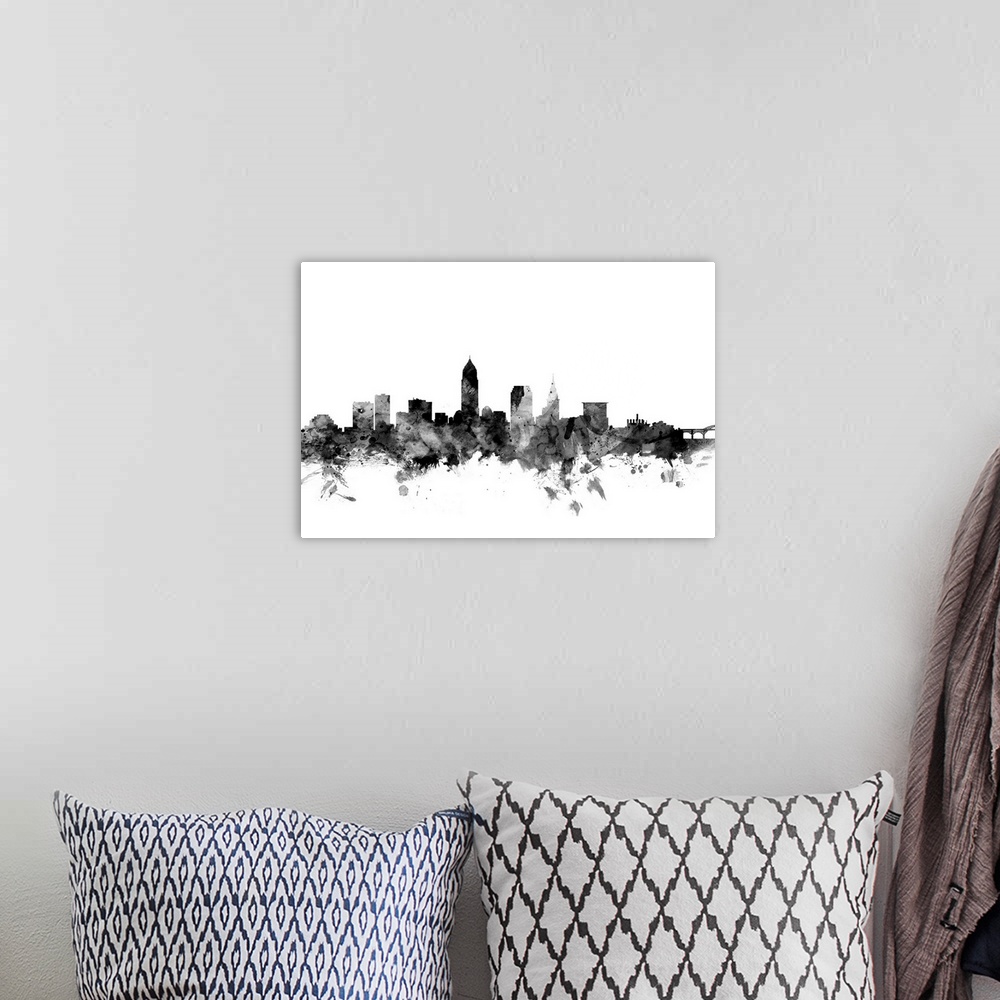 A bohemian room featuring Contemporary artwork of the Cleveland city skyline in black watercolor paint splashes.