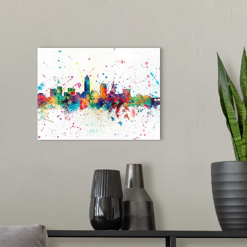 A modern room featuring Wild and vibrant paint splatter silhouette of the Cleveland skyline.