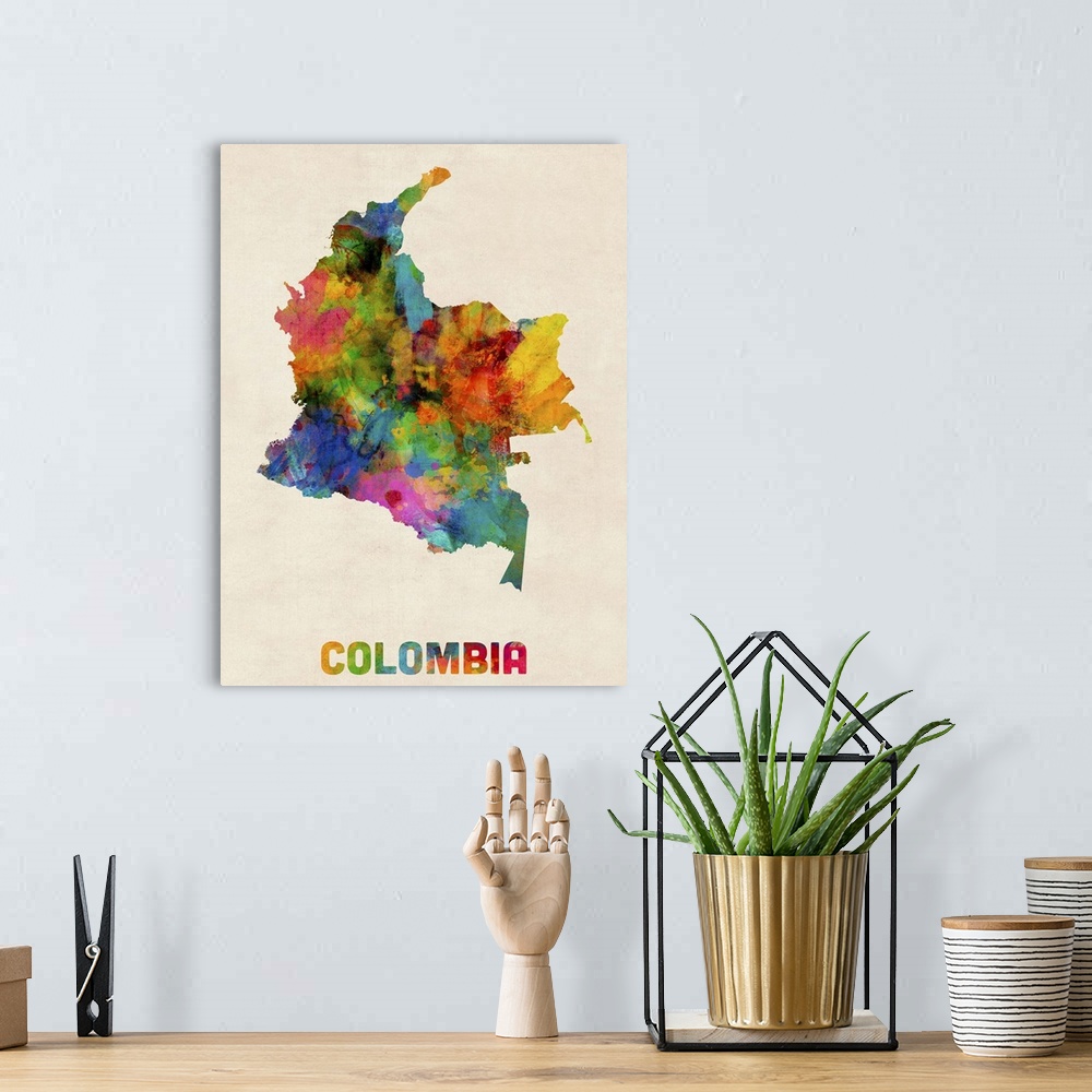 A bohemian room featuring Contemporary piece of artwork of a map of Colombia made up of watercolor splashes.