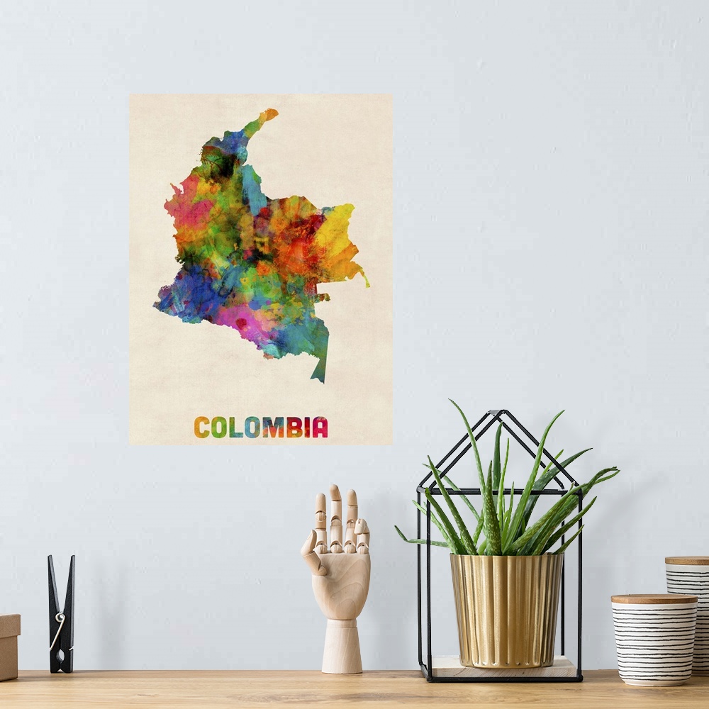 A bohemian room featuring Contemporary piece of artwork of a map of Colombia made up of watercolor splashes.