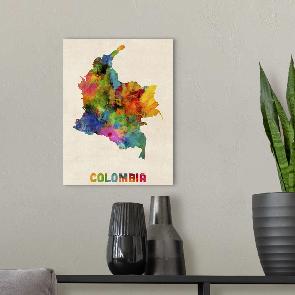 A modern room featuring Contemporary piece of artwork of a map of Colombia made up of watercolor splashes.