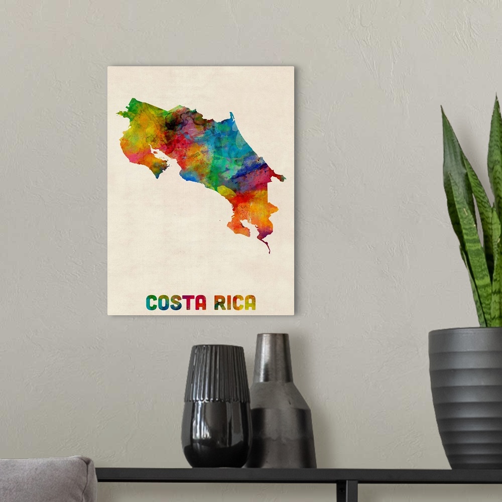 A modern room featuring Contemporary piece of artwork of a map of Costa Rica made up of watercolor splashes.