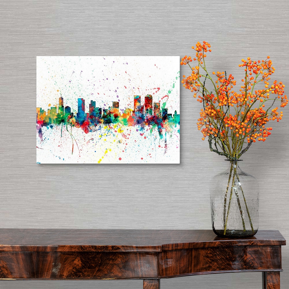 A traditional room featuring Wild and vibrant paint splatter silhouette of the Denver skyline.