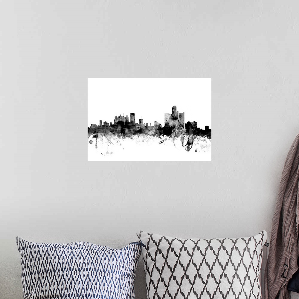 A bohemian room featuring Contemporary artwork of the Detroit city skyline in black watercolor paint splashes.