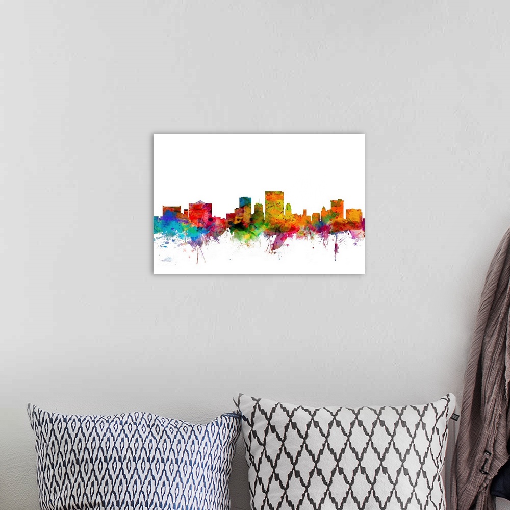 A bohemian room featuring Watercolor artwork of the El Paso skyline against a white background.