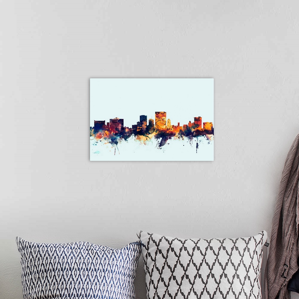 A bohemian room featuring Dark watercolor silhouette of the El Paso city skyline against a light blue background.