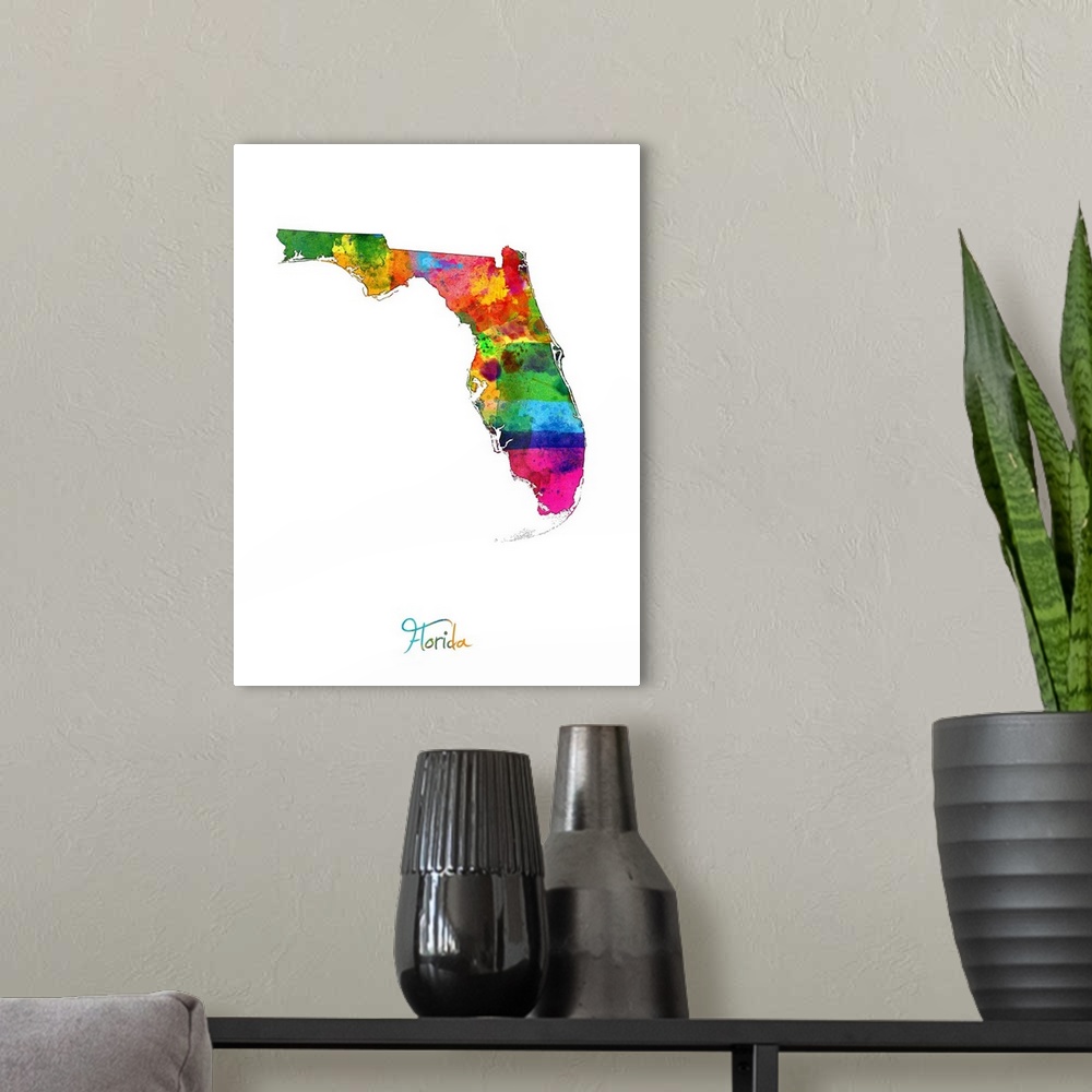 A modern room featuring Contemporary artwork of a map of Florida made of colorful paint splashes.