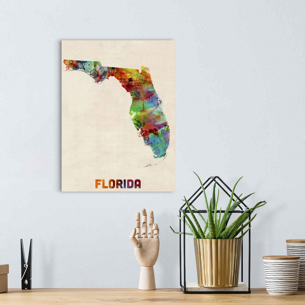 A bohemian room featuring Contemporary piece of artwork of a map of Florida made up of watercolor splashes.