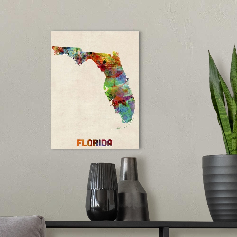 A modern room featuring Contemporary piece of artwork of a map of Florida made up of watercolor splashes.