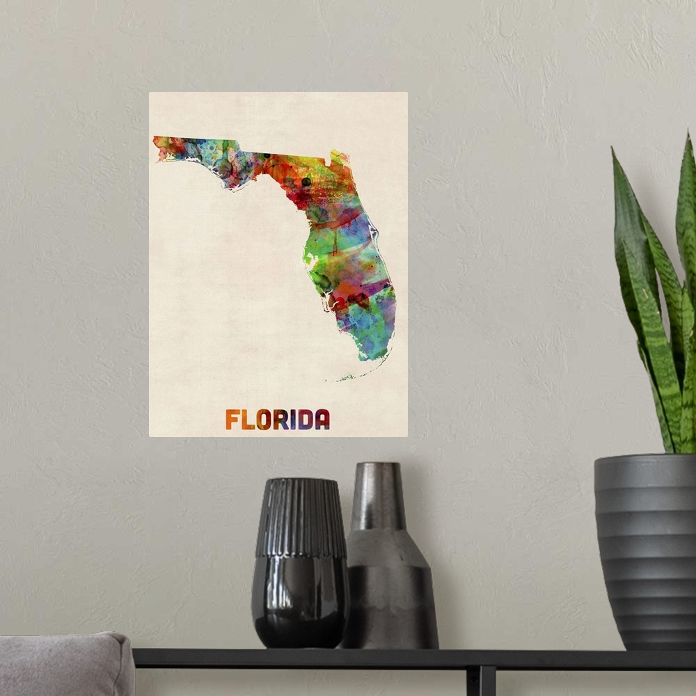 A modern room featuring Contemporary piece of artwork of a map of Florida made up of watercolor splashes.