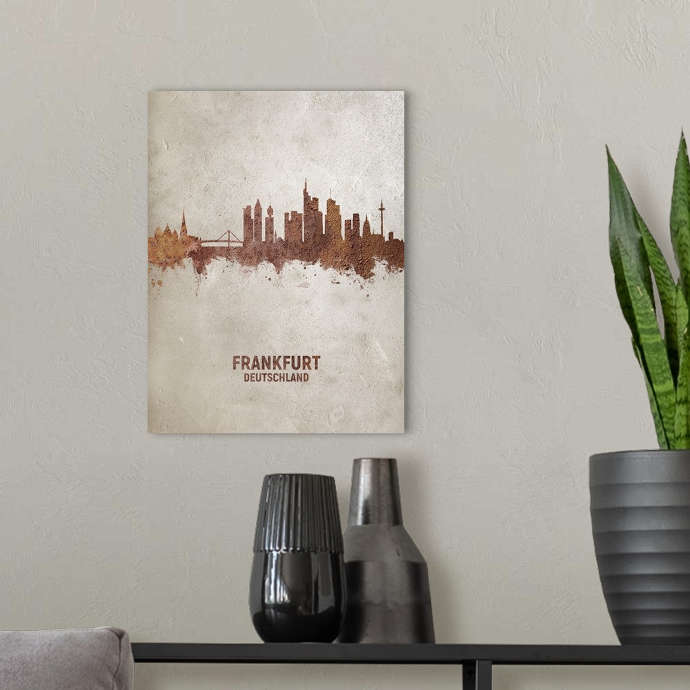 A modern room featuring Art print of the skyline of Frankfurt, Germany. Rust on concrete.