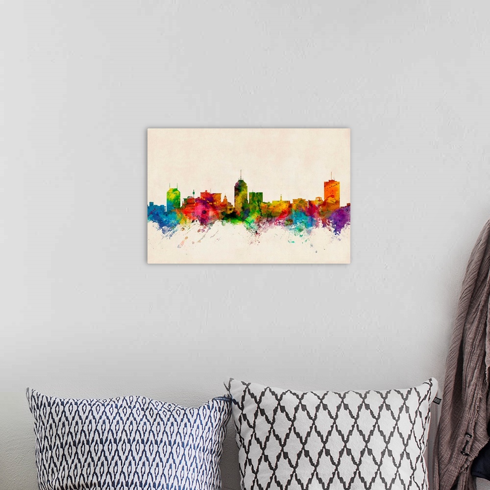 A bohemian room featuring Contemporary piece of artwork of the Fresno skyline made of colorful paint splashes.
